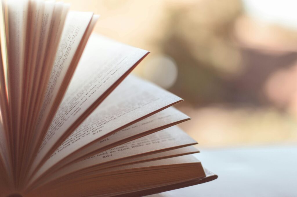 pexels-photo-46274-46274 Close-up view of an open book with pages fanned out against a soft blurred background.